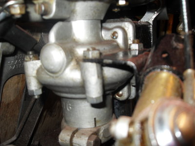 quite a simple looking bracket,held in place by the crankcase studs/nuts.