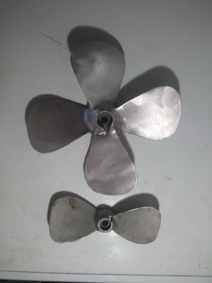 Barge pusher prop with standard 9 inch beside small.jpg