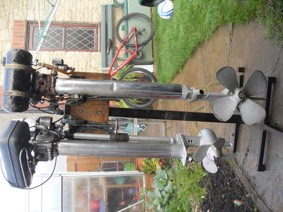 side by side with a model 90 longshaft and the bargepusher 102. BIG PROP for one of these. just to give you some idea of scale with these! HUGE!!!